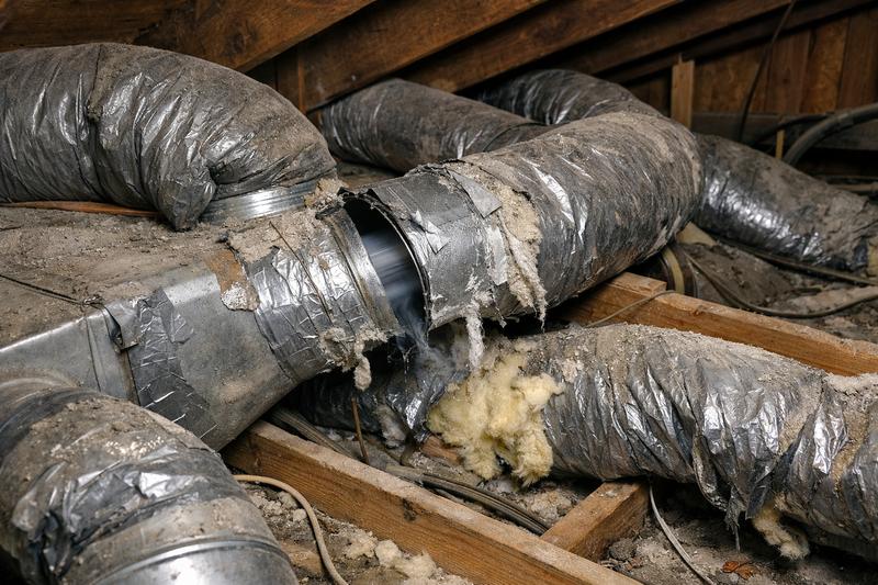 Poorly installed ductwork with disconnected joints, crushed flex duct, and peeling tape
