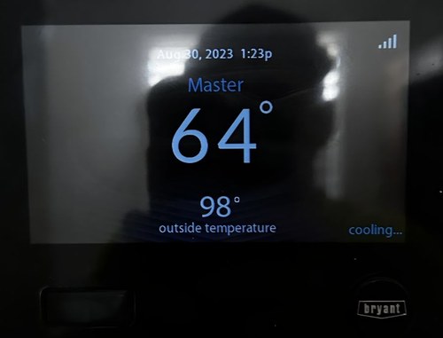 Bryant thermostat showing 64°F in master bedroom with 98°F outdoor