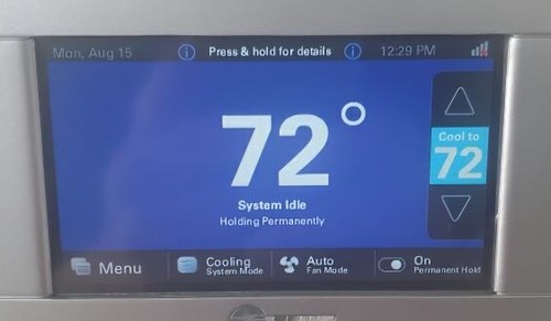 Trane thermostat showing 72°F with system idle, cool to 72°F