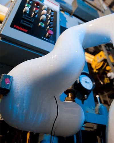 Close-up of Snowball's ice-encased pipes showing decades of continuous operation