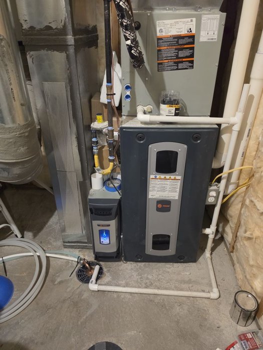 Quality Trane furnace installation with proper clearances and connections